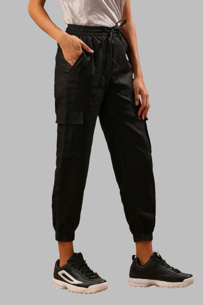 Black Savannah Cargs for Women - 100% Hemp, Breathable and Comfortable - Sustainable Clothing. Crafted from pure hemp, these cargo pants offer style and sustainability. With 6 pockets, elastic waist and ankles, they provide comfort and unrestricted movement. Available in classic shades. Pair with our Cider or Elm Top for a perfect co-ord set.