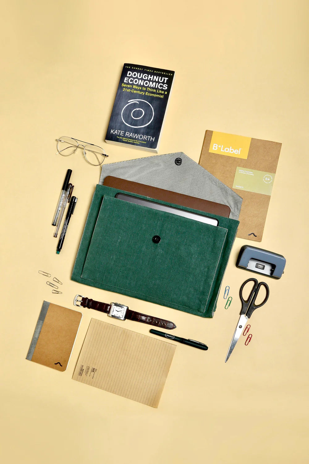 Aloe Laptop/Tablet Sleeve - Deep Green: The perfect corporate sleeve designed with an enveloped shape and double pocket. Store your second device, charger, and other essentials in this unique laptop sleeve. Made from 100% Hemp material with a surplus cotton lining. Dry clean only for care.