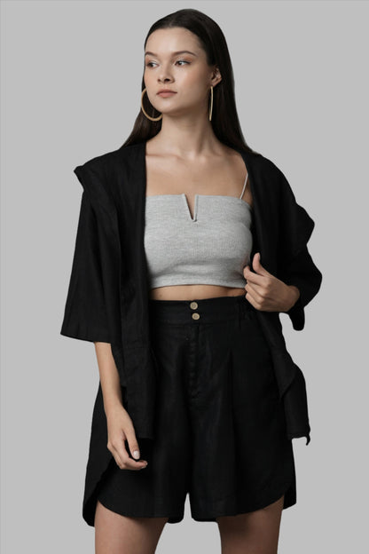 Gender Fluid Overlay Jacket by B Label is made from 100% hemp, providing breathability and comfort. This hooded oversized jacket features an overlap back pattern and a soft high low hemline. Perfect for lounging in the city or by the sea. Designed for both men and women.